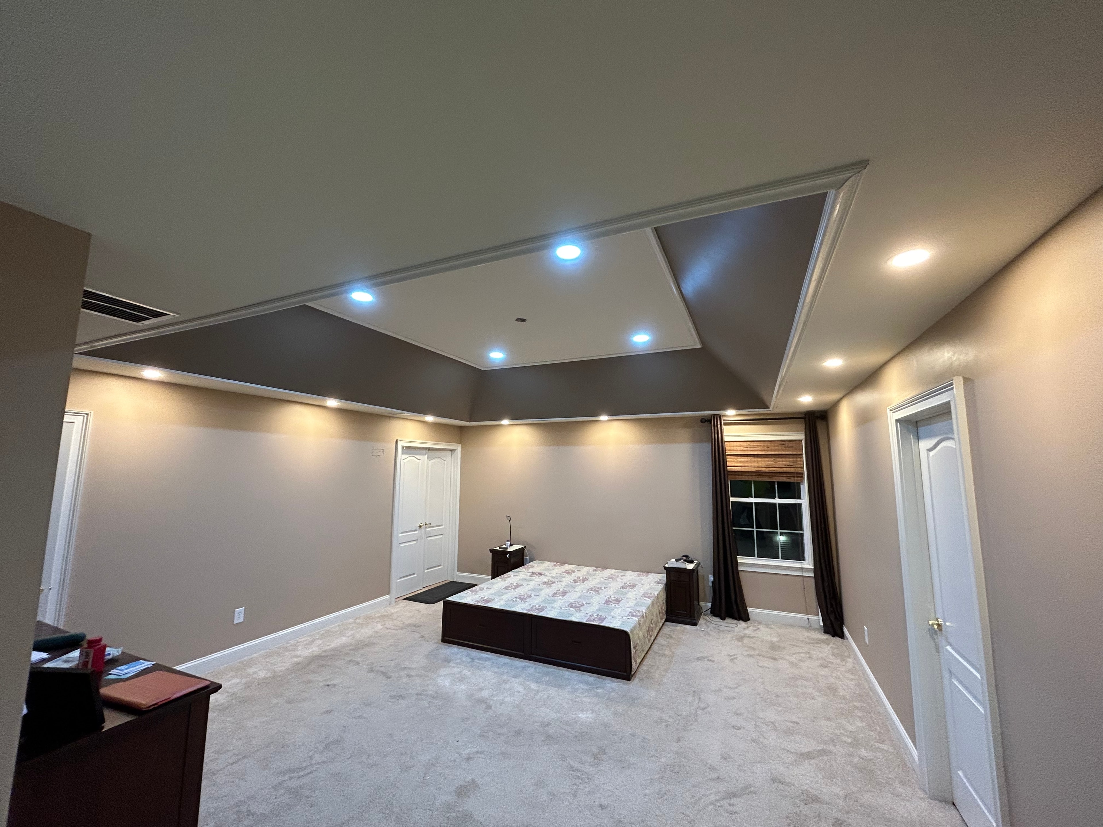 Recessed lighting installation in a residential bedroom