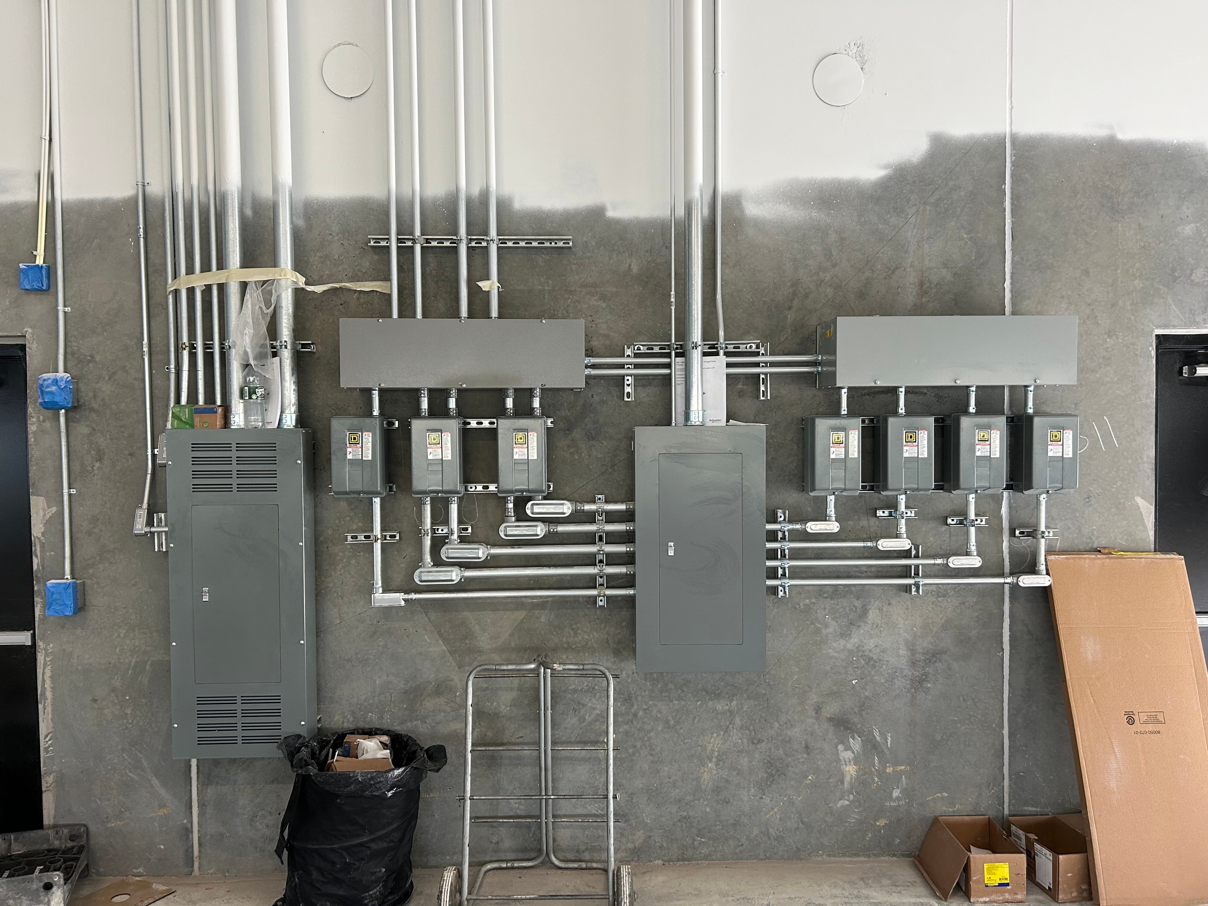 Pickleball Kingdom industrial electrical panel and conduit installation