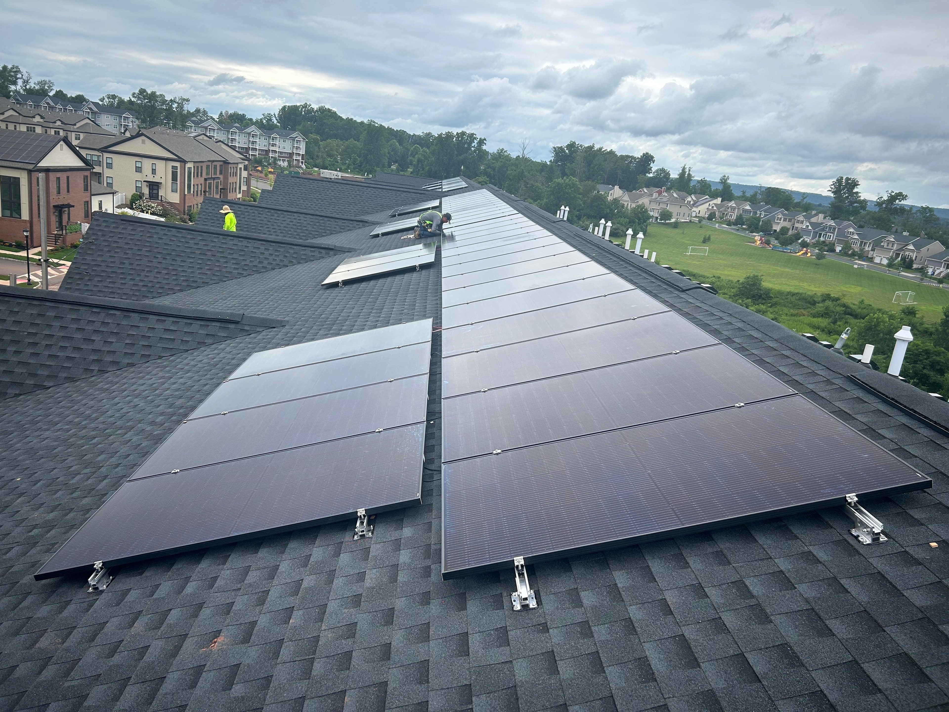 Solar panels installed on residential rooftop at Villas at Montgomery
